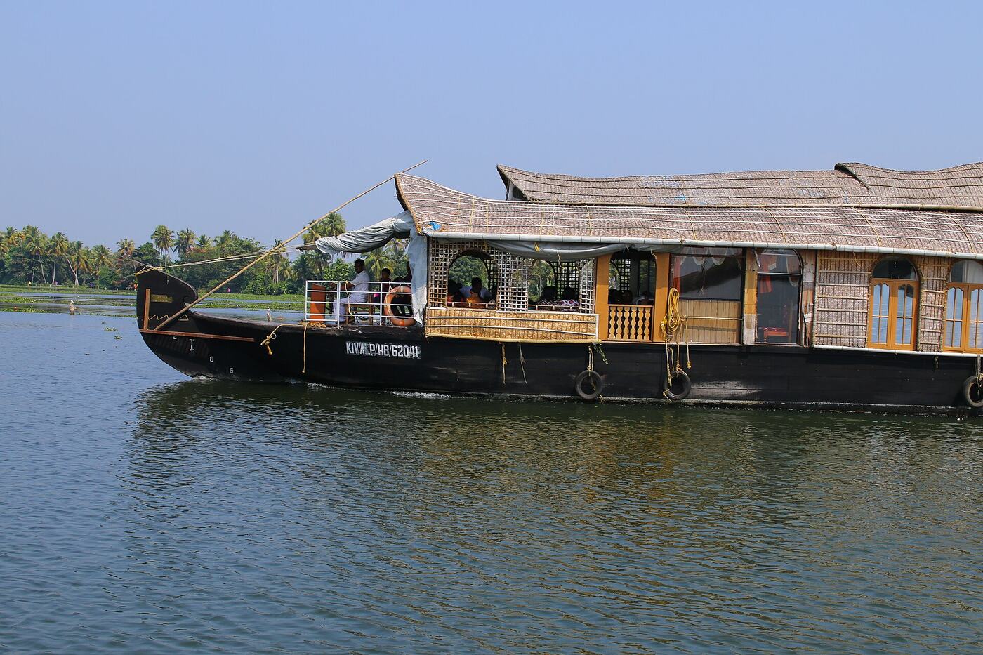 A Kerala houseboat cruising Vembanad Lake in daylight